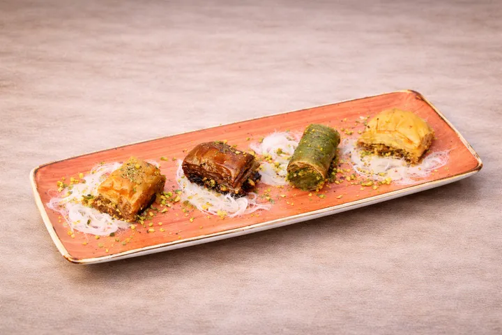 Plate of assorted baklava with pistachio