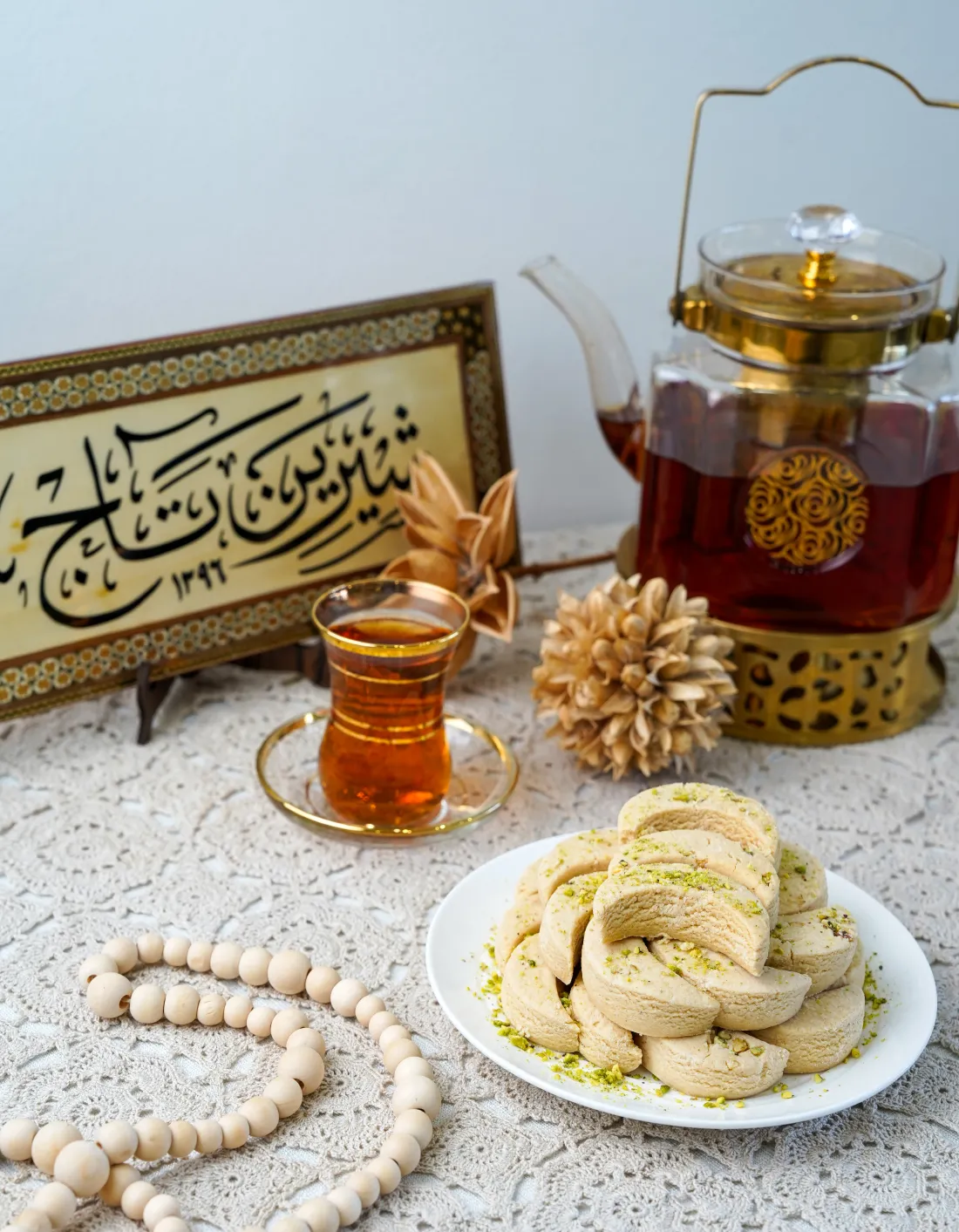 Persian tea, pistachio sweets and Shirin Taj calligraphy